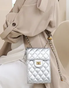 Silver quilted leather mini phone bag with chain strap, luxury style crossbody bag detail.