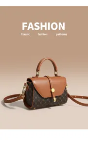 Detailed view of the vintage brown top-handle shoulder bag with classic monogram pattern and hardware.