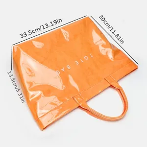 Large capacity waterproof DuPont paper tote bag in vibrant orange with dual top handles.