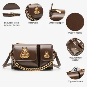 Brown PU leather crossbody bag with gold rabbit hardware, chain strap and multiple pockets.