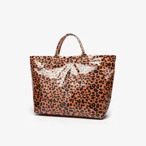 Waterproof leopard print transparent tote bag, stylish large capacity commuter handbag.
