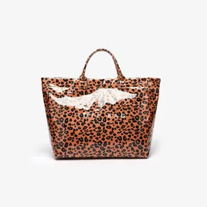Detailed view of the glossy leopard print tote bag showing the waterproof finish and dual top handles.