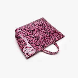 Stylish pink leopard print tote bag for women, large capacity waterproof handbag for daily commute.