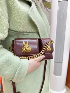 Fashion leather crossbody bag for women with metal rabbit decor and chain strap trendy style.
