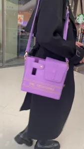 Purple crossbody water bottle bag with crocodile texture flap, stylish outdoor cup holder.