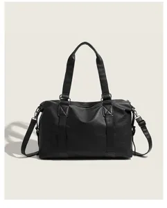 Detailed view of black travel duffel bag, large capacity tote shoulder bag for women daily use.