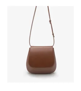 Chestnut brown leather saddle bag for women, stylish retro crossbody bag.