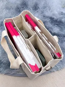 Canvas diaper bag interior detail showing multi-compartment storage capacity design