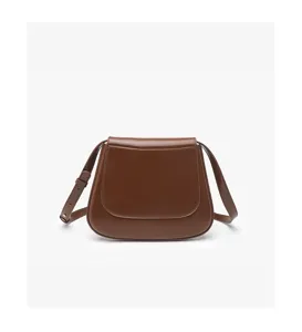 Brown leather saddle bag for women, elegant vintage crossbody shoulder bag with strap.