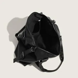 Detailed top view showing the spacious interior compartment and black lining of the bag.
