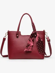Wine red leather tote bag with top handles and polka dot scarf main view studio shot