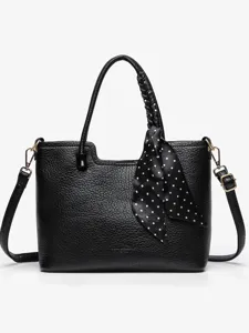 Black leather tote bag for women, stylish large capacity shoulder bag with polka dot scarf.