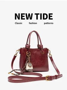 Red leather handbag for women, vintage top handle shoulder bag with adjustable strap.