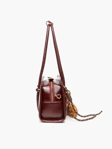Red bowling handbag for women, retro leather shoulder bag with top handles and stylish charms.