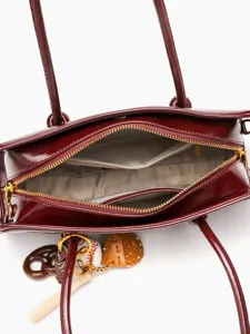 Red vintage bowling handbag for women, stylish top handle shoulder bag with cute charms.