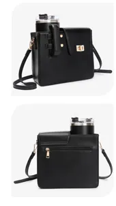 Black cross-body bag with built-in tumbler holder, detailed front lock and back zipper pocket.