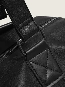 Black PU leather travel handbag main view showing premium hardware and fine texture.