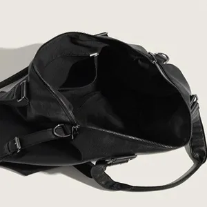Trendy women's black casual travel tote bag, top-open view showing large capacity and zipper.