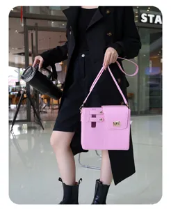 Pink PU leather shoulder crossbody bag with metallic lock closure, stylish daily accessory detail.