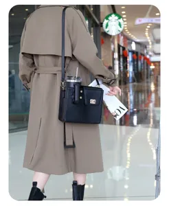 Outdoor portable black crossbody bag detail, featuring built-in water bottle holder slot.