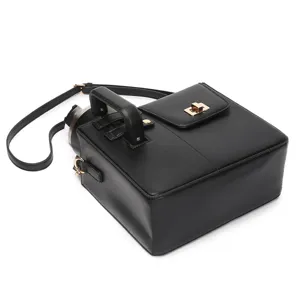 Detailed view of black leather water bottle bag sleeve with handle and strap, simple style.