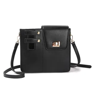 Detailed view of the black leather shoulder bag showcasing the side cup holder and gold hardware.