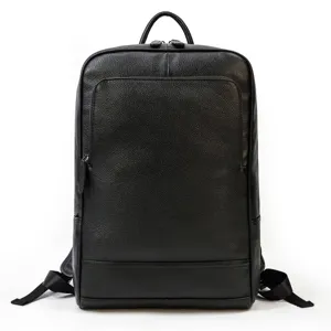 Detailed view of black genuine leather business backpack, premium texture, metal zippers.