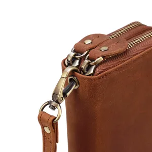 Cartera de hombre de cuero genuino doble cremallera bolso de mano vista de detalle marrón