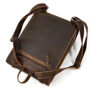 Detail view of the vintage crazy horse leather men backpack showing fine stitching and metal zippers.