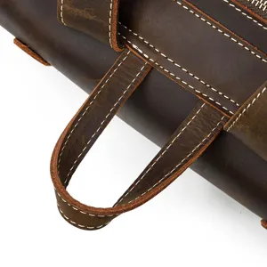 Close-up detail of vintage crazy horse leather men backpack handle with neat stitching.