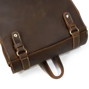 Close-up detail of vintage crazy horse leather backpack, genuine cowhide with sturdy hardware.