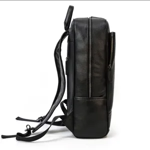 Side view detail of the black leather backpack showing texture and sturdy zippers.