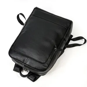 Detailed view of black genuine leather business backpack, premium texture and durable straps.