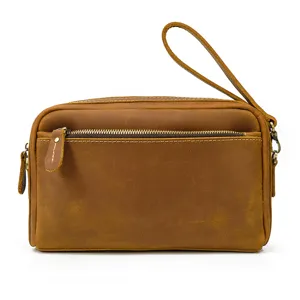 Sac pochette homme en cuir veritable vintage avec double fermeture eclair et dragonne.