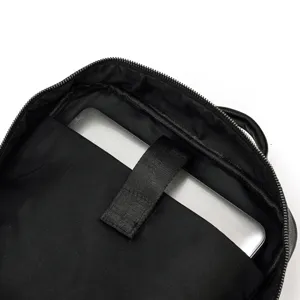 Detailed view of the black leather men's backpack interior with laptop compartment.