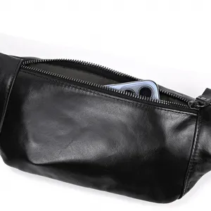 Detail view of black genuine leather chest bag zipper pocket showcasing phone storage capacity.