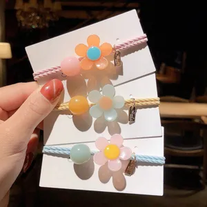 Cute resin flower hair ties with colorful beads and sweet ins style design for women.