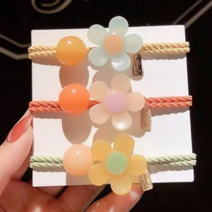 Close-up detail of stylish resin flower hair ties set featuring colorful beads and cute charms.