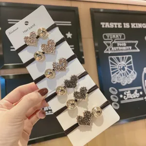 Korean style hair band set with sparkling rhinestones and golden metal balls on card.