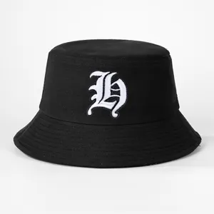 Black bucket hat featuring white gothic letter embroidery, stylish casual outdoor hat for men and women.