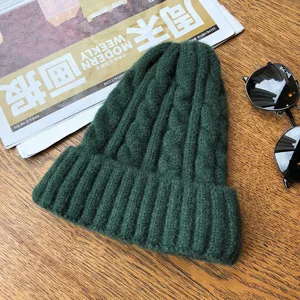 Cozy dark green cable knit beanie for women and men, thick winter warm pull-on skull cap.