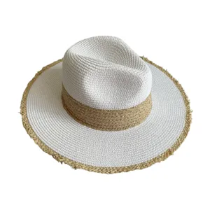 Detailed view of the stylish two-tone straw hat, featuring a woven brim and classic fedora crown.