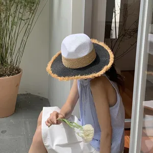 Chic ins vacation color block straw hat with stylish fringe brim for summer sun protection.