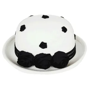 Detailed view of a vintage white wool felt bowler hat featuring chic black rose decorations.