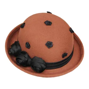 Detailed view of vintage wool felt bowler hat featuring elegant black fabric rose decor.
