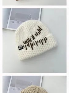 Thickened warm knit beanie hat featuring unique brown embroidery detail, cozy winter style.