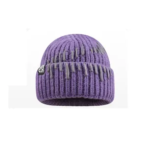 Cozy purple knit beanie for women, thick warm winter hat with stylish stitch details.