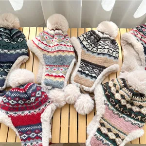 Thickened winter knit hat with earflaps and pom-pom, cozy jacquard fleece-lined bomber cap.