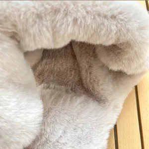 Close-up detail of thick plush winter hat lining, ultra-soft fluffy faux fur fabric texture.