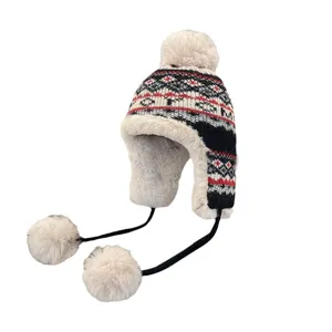 Thickened warm winter knit earflap hat with jacquard pattern and fluffy pom-pom.